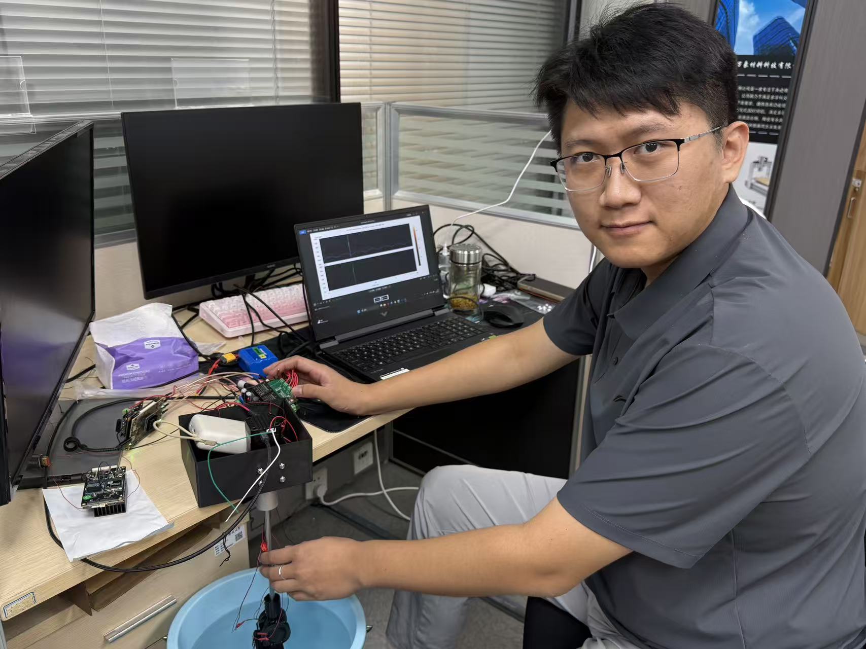 William Liu testing sonar hardware and acoustic data